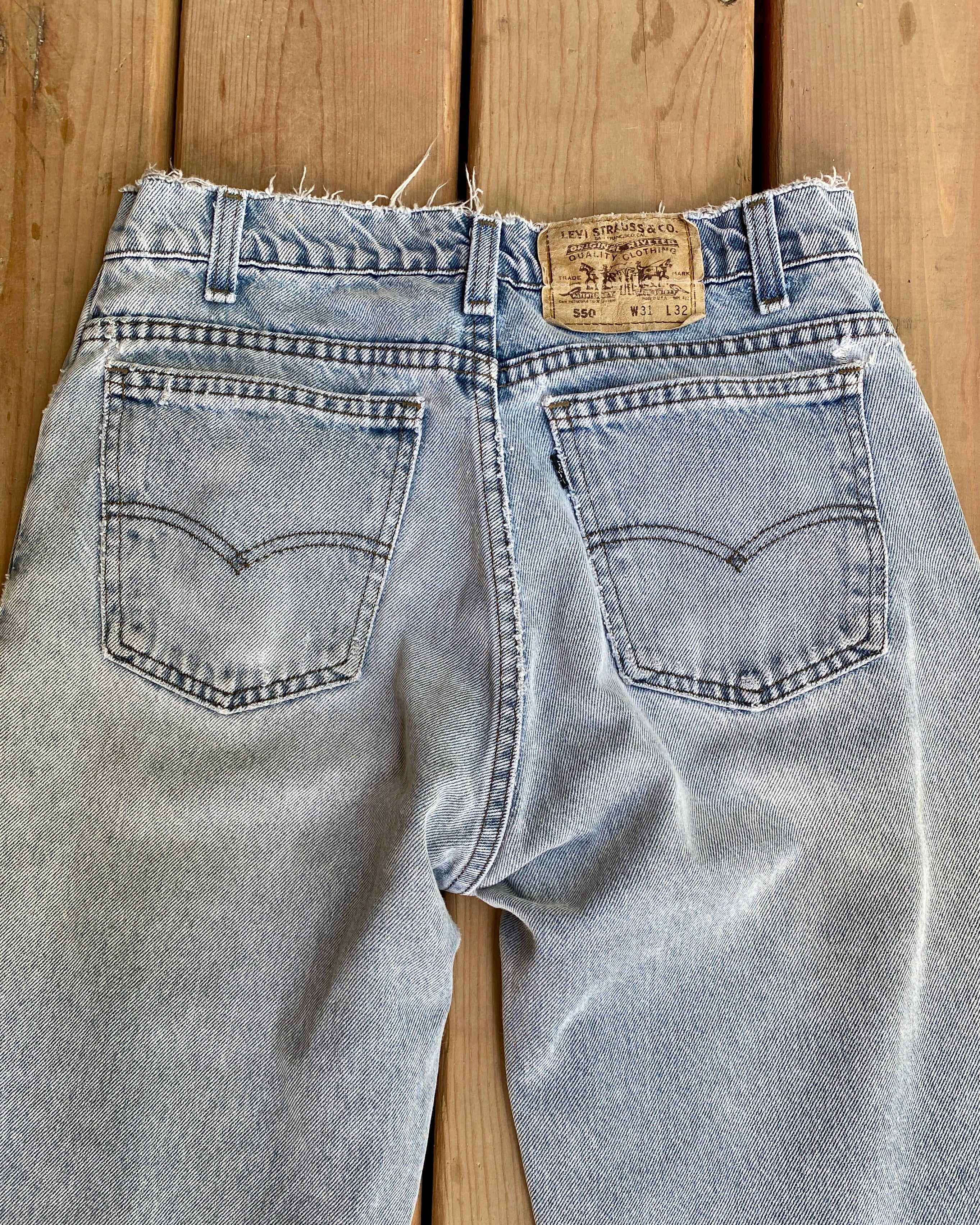 Vintage 1980s Black Tab Levis 550 Light Grey Wash Jeans size 30