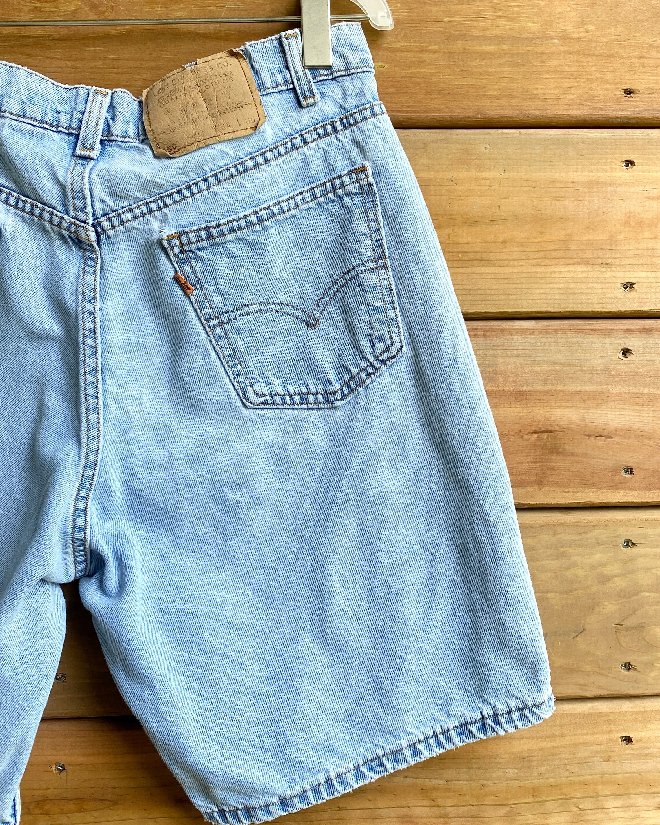 Vintage 1990s Levis 550 Orange Tab Hemmed Jean Shorts Light Wash Made in USA Size 33