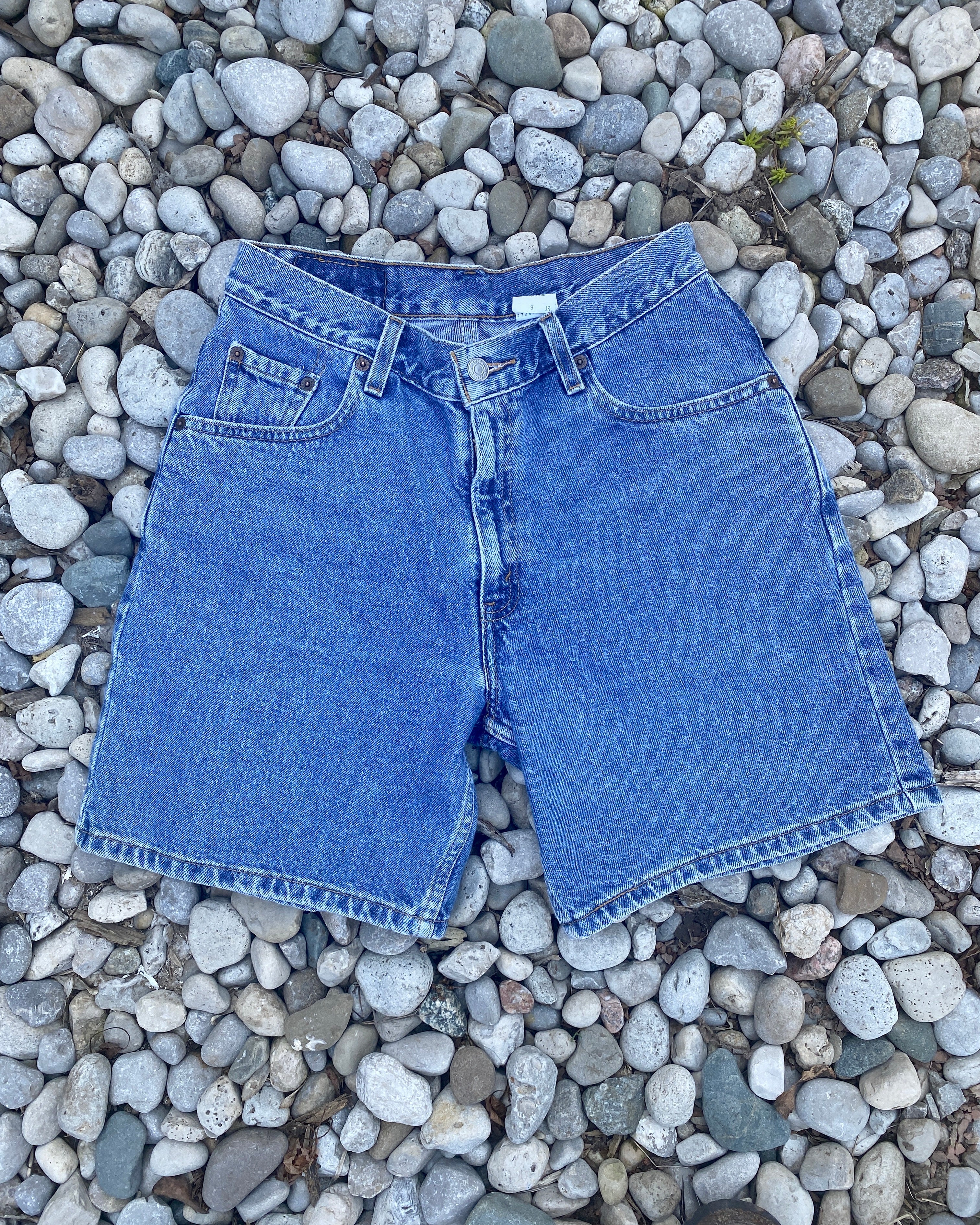 Vintage 1990s Levis Medium Wash Denim High Waist Jean Shorts size 28