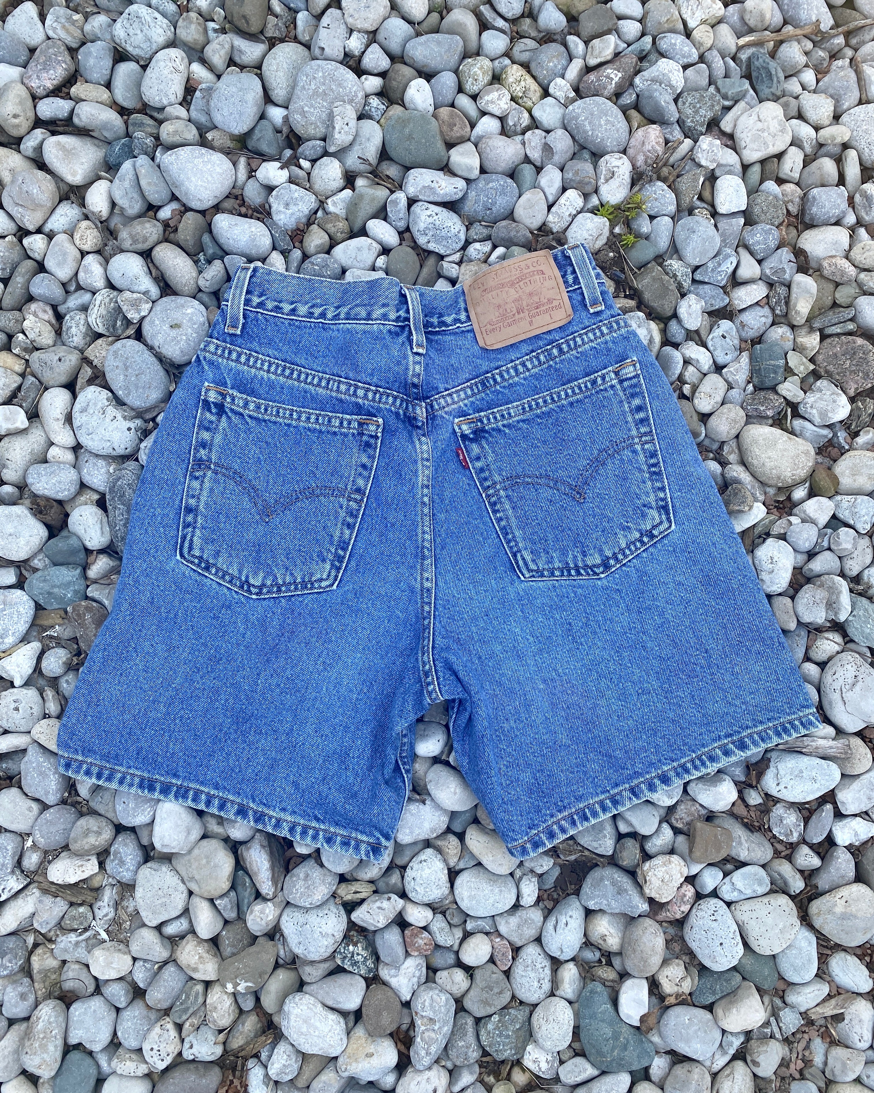 Vintage 1990s Levis Medium Wash Denim High Waist Jean Shorts size 28