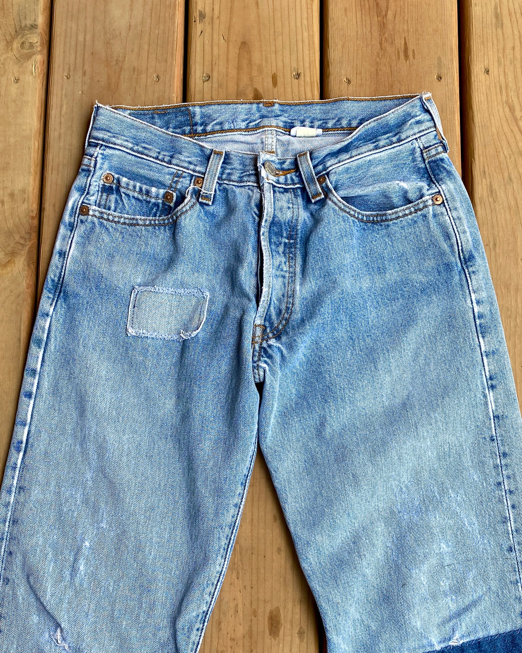 Vintage 1990s Levis 501 Light Wash Patched Jeans size 28