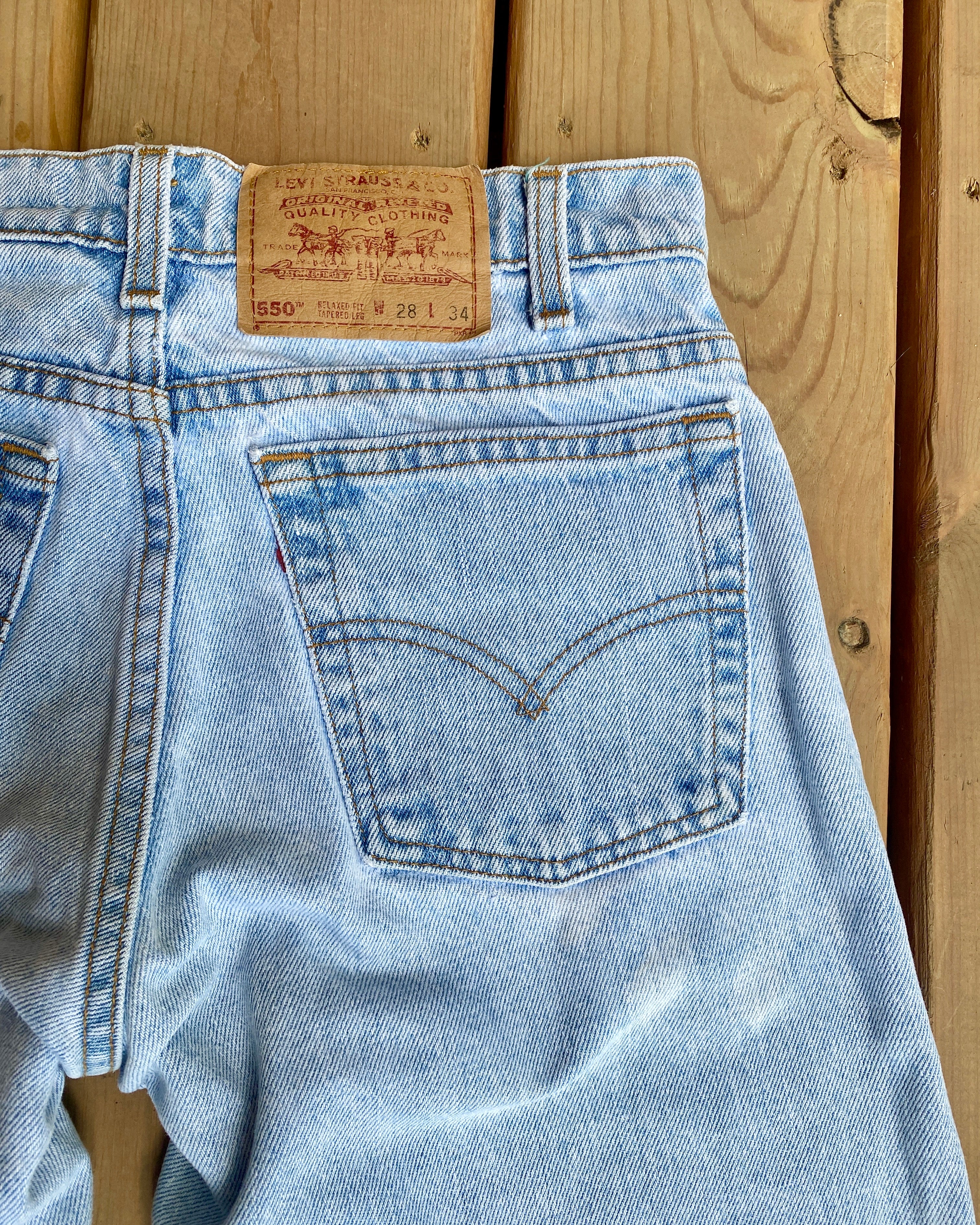 Vintage 1980s Levis 550 Light Wash Jeans size 27 Made in USA