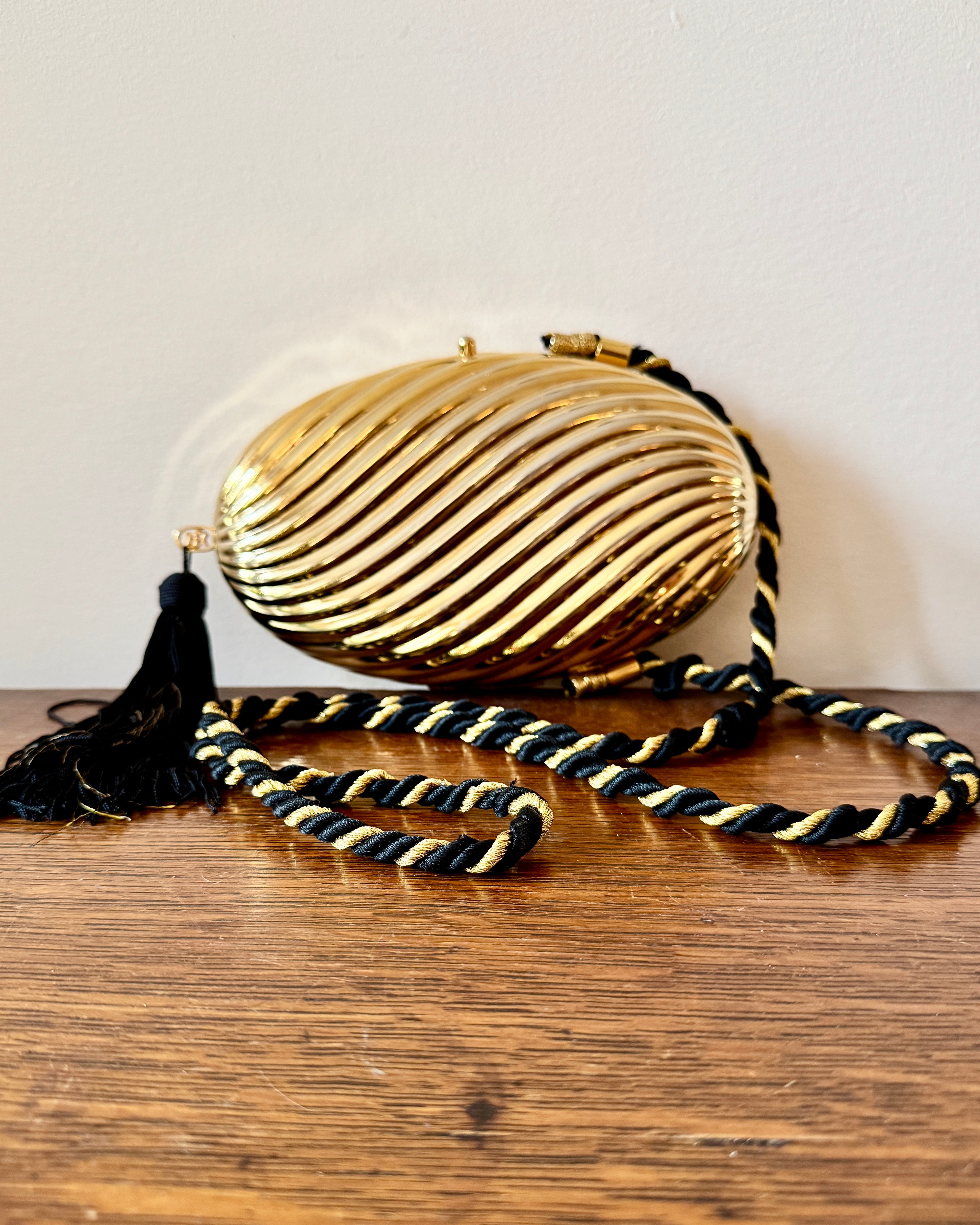 Vintage 1970s SCHEILAN Hard Gold Metal Egg Box Clutch Purse Handbag with Tassel and Rope Chord Strap Made in Italy