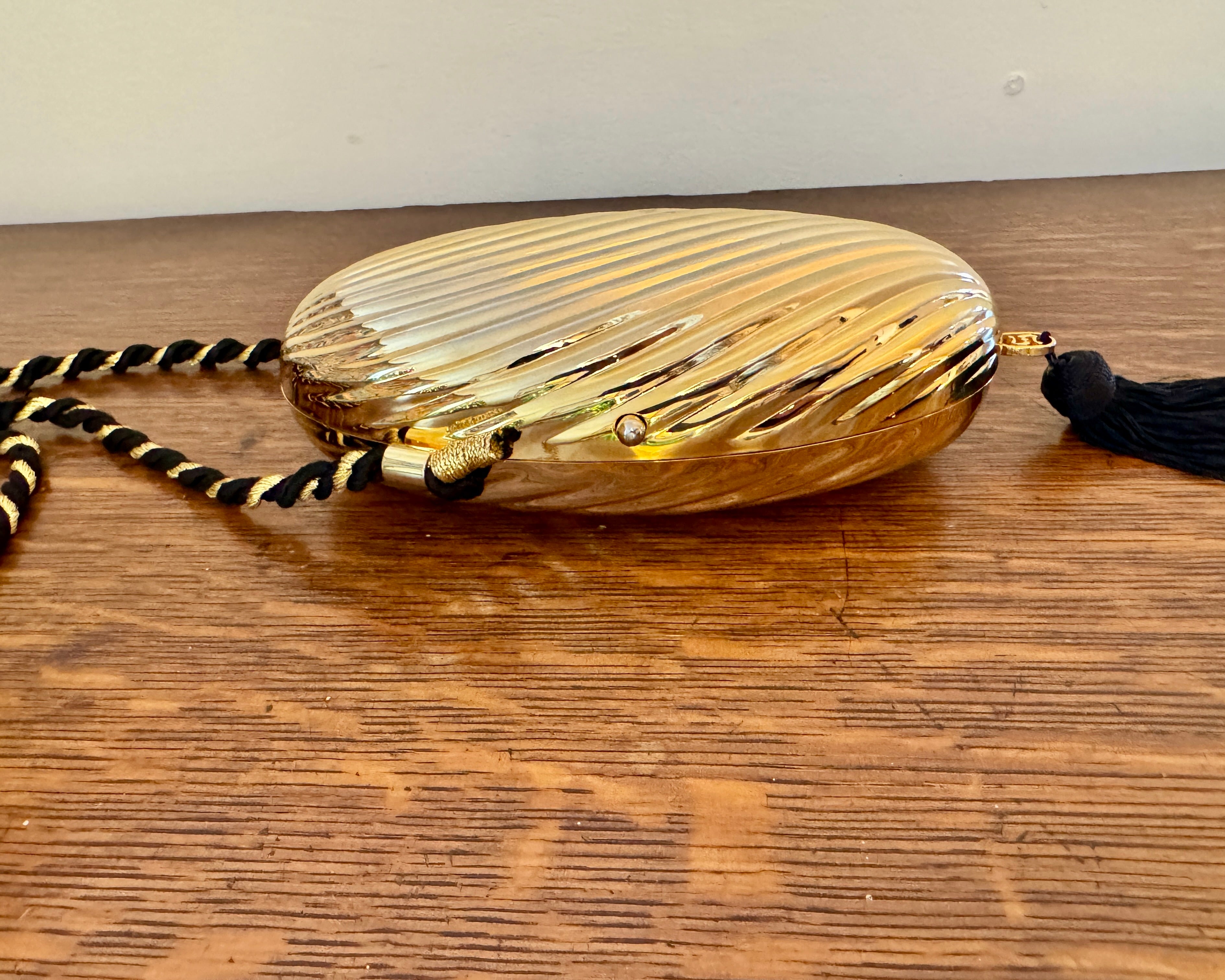 Vintage 1970s SCHEILAN Hard Gold Metal Egg Box Clutch Purse Handbag with Tassel and Rope Chord Strap Made in Italy