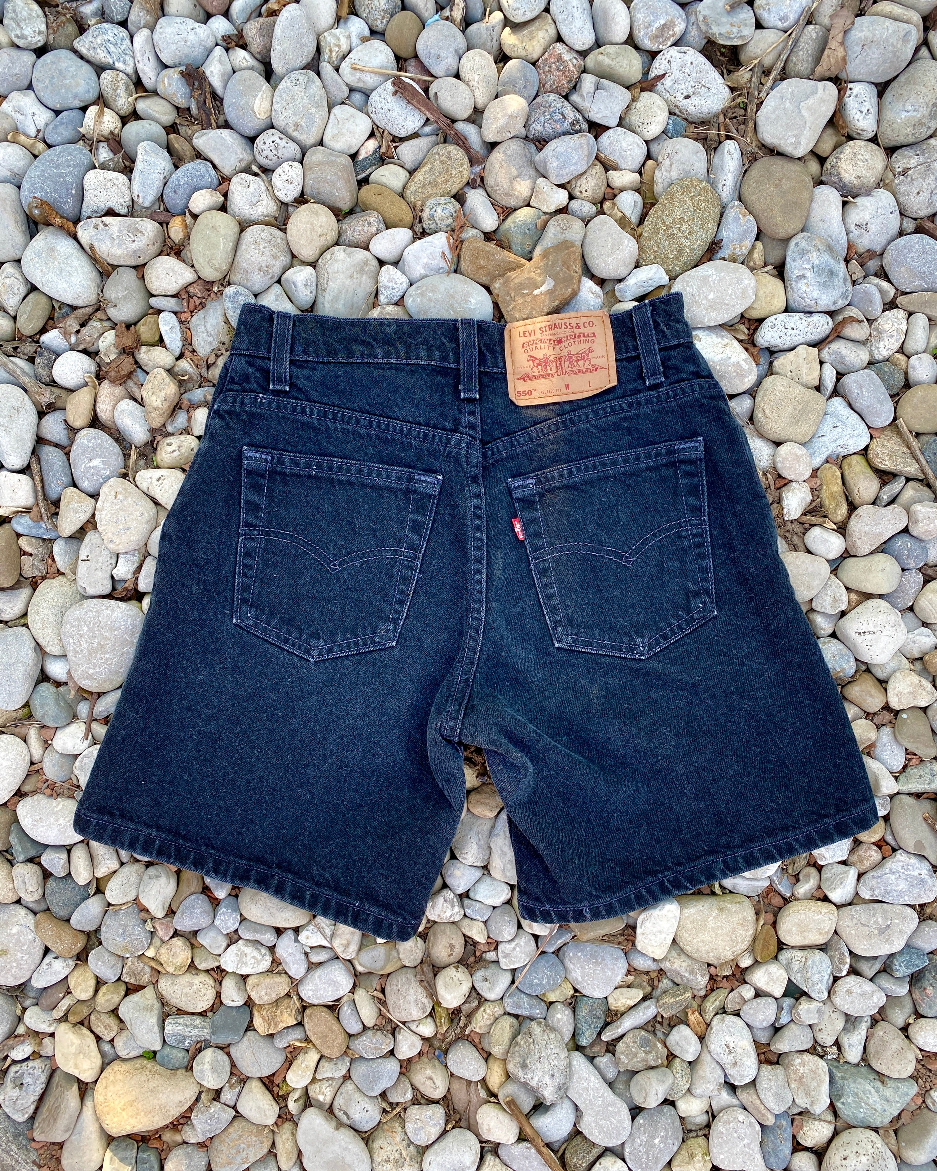 Vintage 1990s Levis 550 Black Wash Denim High Waist Jean Shorts Made in USA size 27