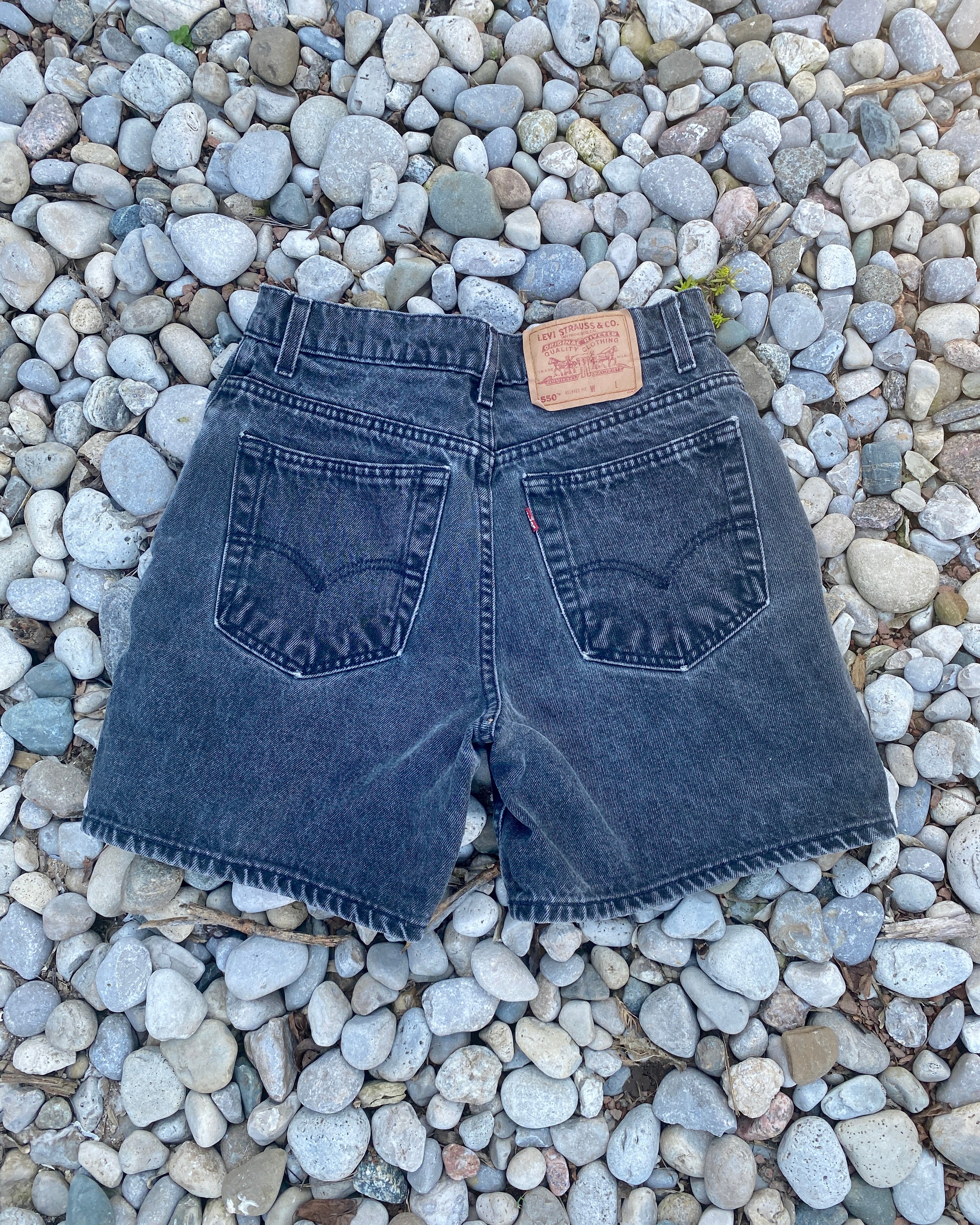 Vintage 1990s Levis 550 Black Wash Denim High Waist Jean Shorts Made in USA size 28