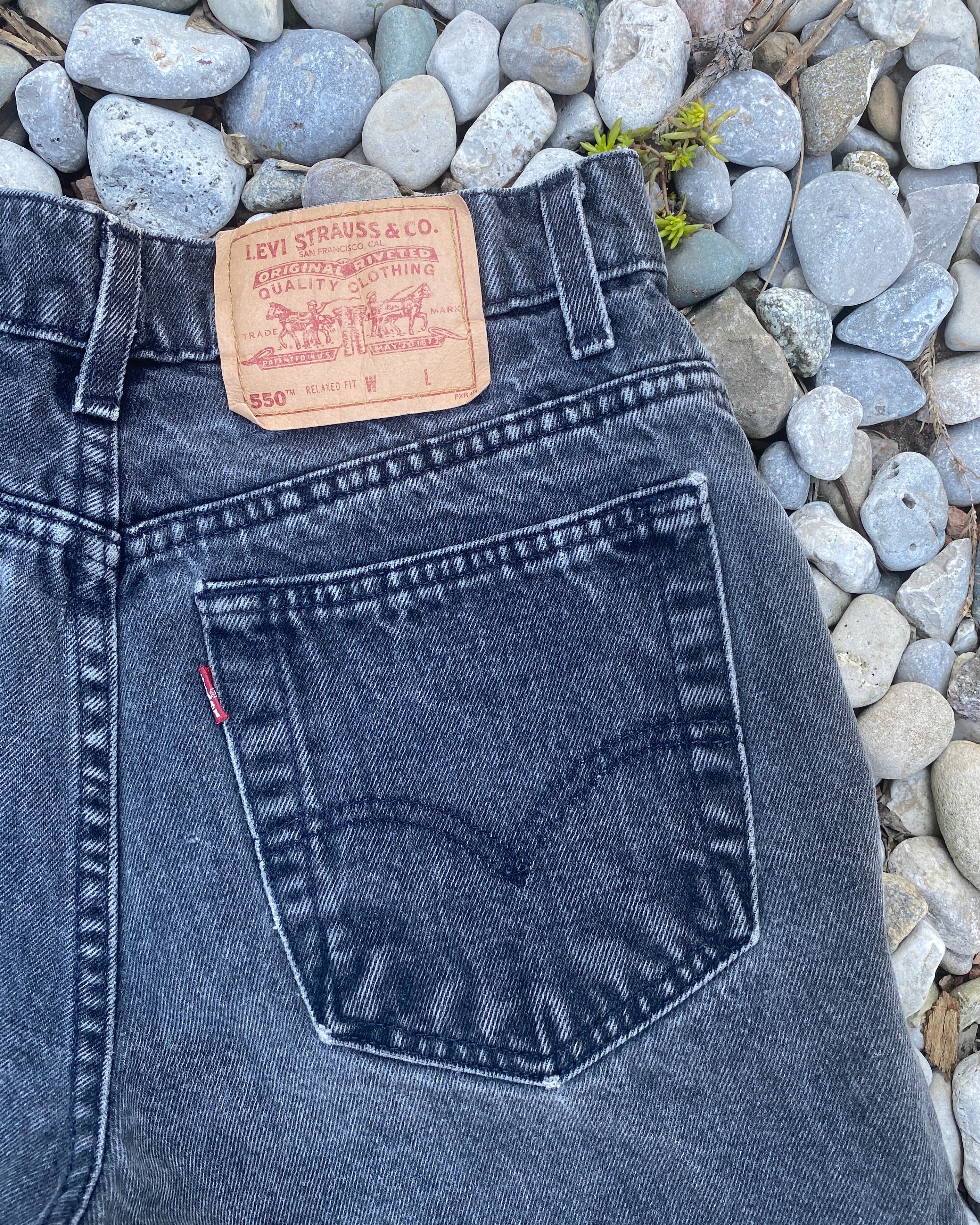 Vintage 1990s Levis 550 Black Wash Denim High Waist Jean Shorts Made in USA size 28