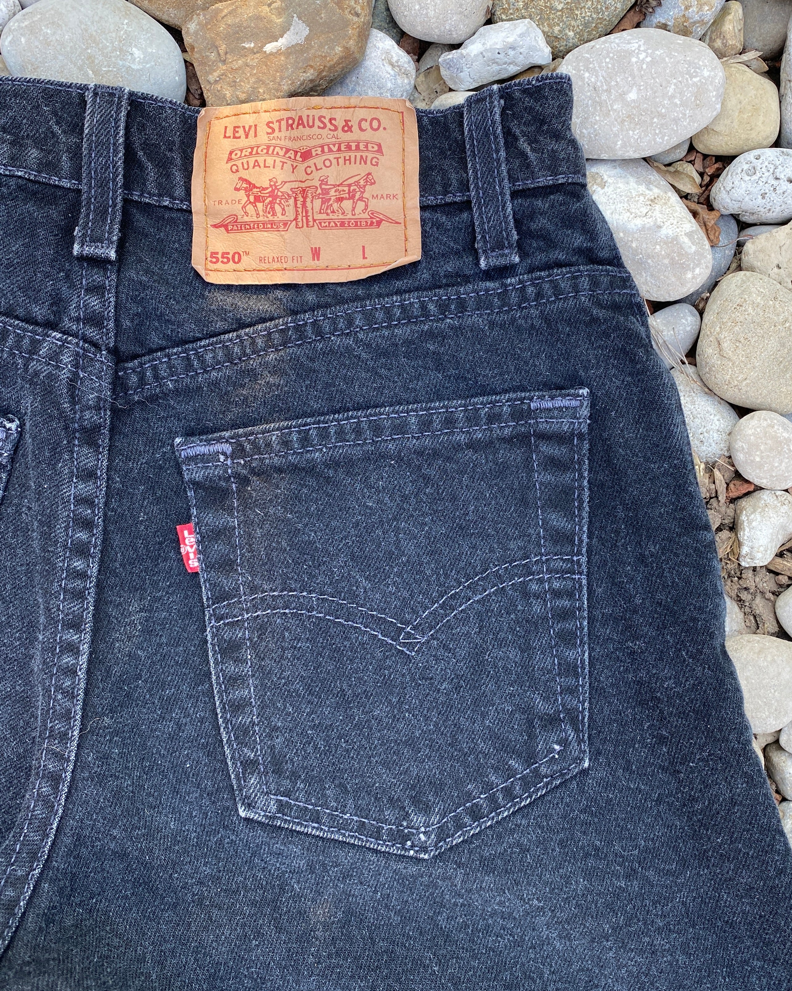 Vintage 1990s Levis 550 Black Wash Denim High Waist Jean Shorts Made in USA size 27